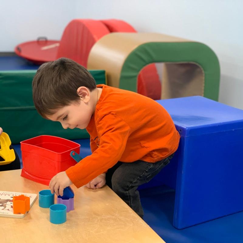 Boy playing with blocks in the EI playroom at the Lucas County Board of DD